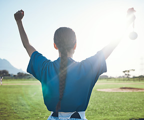 Image showing Sports, success and woman back with baseball medal at a stadium for victory, celebration or award. Softball, reward and female winner celebrating fitness target, match or competitive game performance