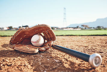 Image showing Glove, bat and baseball gear on the sand for a game, professional competition or sports. Ground, fitness and equipment for a match, fitness or training for softball on the sand in summer for cardio