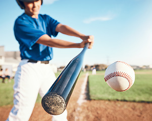 Image showing Baseball, hit and person on field for training, sports or fitness competition outdoor. Closeup of pitcher, ball or bat by softball player with power strike at stadium for action, speed or performance