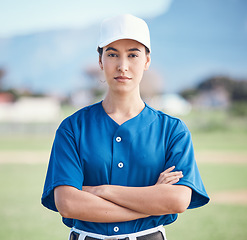 Image showing Sports, portrait and woman with arms crossed for baseball field training, workout or match. Fitness, face and softball player at a park proud, serious and mindset focus against blurred background