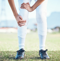 Image showing Knee pain, fitness and sports person with legs injury from baseball challenge, grass field workout or exercise. Medical emergency or problem, training accident and closeup athlete with muscle strain