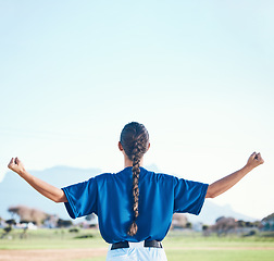 Image showing Woman, fist pump and winner, softball and athlete on outdoor pitch, celebration and success with sports. Back view, baseball player and mockup space, fitness and achievement with cheers and winning