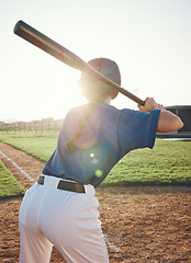 Image showing Baseball, bat and a person outdoor on a pitch for sports, performance and competition. Behind professional athlete or softball player for game training at a field or stadium in summer with lens flare