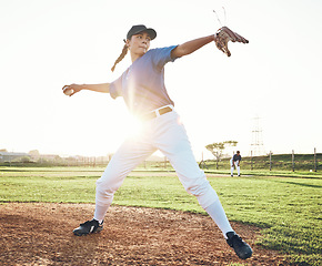 Image showing Pitching a ball, baseball and person outdoor on a pitch for sports, performance and competition. Professional athlete or softball player for a game, training or exercise challenge at field or stadium