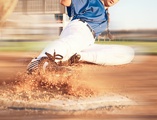 Image showing Slide, softball action and player in match or game for sports competition on a pitch in a stadium. Goal, ground and tournament performance by athlete or base runner in training, exercise or workout