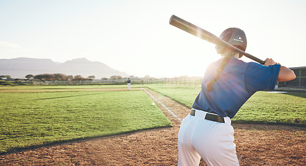 Image showing Bat, baseball and person swing outdoor on a pitch for sports, performance and competition. Behind professional athlete or softball player for game, training or exercise challenge with stadium banner