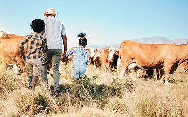 Image showing Farm, family and cow, agriculture and livestock with man and kids, sustainability and agro business in countryside. Farmer, children and walk in field, environment and cattle animal outdoor with back