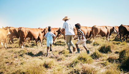 Image showing Farm, cattle and father holding hands with children in countryside for ecology, adventure and agriculture. Family, sustainable farming and dad with kids for bonding, relax and learning with animal