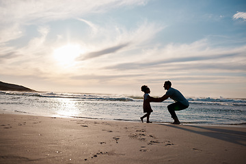 Image showing Child is running to father, beach and silhouette, family with games and love, travel and freedom together outdoor. People, sunset and adventure, man and girl bonding with tropical holiday and nature