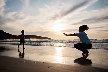 Image showing Child is running to mother, beach and silhouette, family with games and love, travel and freedom together outdoor. People, sunset and adventure, woman and girl bonding on tropical holiday and nature
