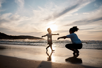 Image showing Kid is running to mom, beach and silhouette, family with games and love, travel and freedom together outdoor. People, sunset and adventure, woman and girl bonding on tropical holiday and nature