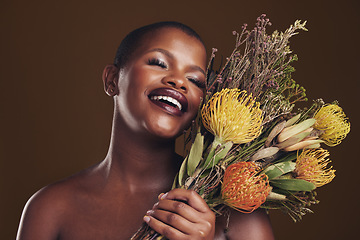 Image showing Skincare, smile and protea with the face of a black woman in studio on brown background for natural treatment. Beauty, plant or cosmetics and a young model posing for aesthetic wellness with flowers