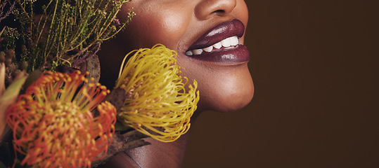 Image showing Beauty, makeup and plants with lips of black woman in studio for natural, spa and mockup space. Cosmetics, flowers and closeup with model on brown background for sustainability, glow and banner