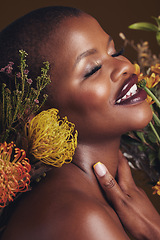 Image showing Skincare, beauty and protea flower with a black woman in studio on brown background for natural treatment. Face, plant or cosmetics and a young model indoor for aesthetic wellness with a smile