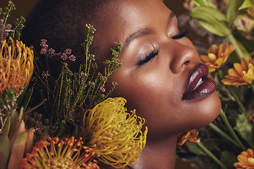 Image showing Black woman, flowers and beauty with face, makeup and natural cosmetic care isolated on studio background. African model, plants and nature with sustainable skincare, eyes closed with facial and glow