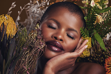 Image showing Beauty, makeup and plants with face of black woman in studio for natural, spa and environmental. Cosmetics, flowers and dermatology with model on brown background for sustainability and glow