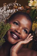 Image showing Beauty, cosmetic and black woman with flowers in a studio for natural face makeup for cosmetology. Happy, smile and young African female model with floral aesthetic isolated by a brown background.