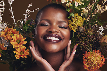 Image showing Skincare, cosmetics and protea with the face of a black woman in studio on brown background for natural treatment. Smile, plant or beauty and a happy model for eco or aesthetic wellness with flowers