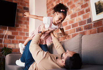 Image showing Couch, airplane and father playing child or daughter enjoy game as bonding for care together in a home or house. Fly, love and parent with kid in living room, happy and smile on weekend for happiness