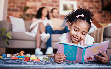 Image showing Child, toys and reading in home with knowledge development and building block in living room. Family, fun and youth learning with a young girl and parents in a house together with care and bonding