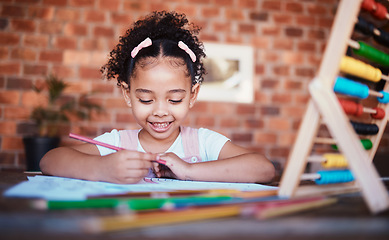 Image showing Homework, writing and child at home with smile, learning and happy for project. Young girl, problem solving and knowledge development at a house with student education and notes at table for school