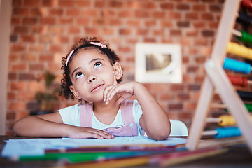 Image showing Homework, thinking and child at home with study, learning and ideas for project. Young girl, problem solving and knowledge development at a house with student education and notes at table for school