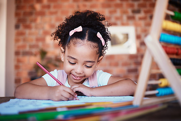 Image showing Homework, writing and child drawing at home with study, learning and smile for project. Young girl, problem solving and youth development at house with student education and notes at table for school