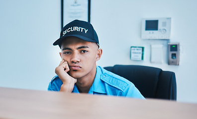 Image showing Portrait, surveillance and a bored man security guard sitting at a desk in his office to serve and protect. CCTV, safety and control with a tired officer working as a private service employee