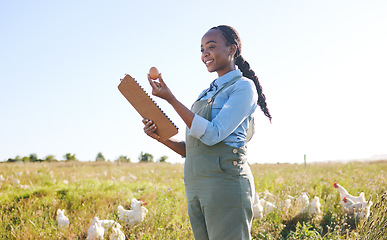 Image showing Woman in field with chickens, clipboard and egg, quality assurance and sustainable small business farming in Africa. Poultry farm inspection, checklist and farmer in countryside with birds in grass.