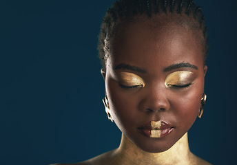 Image showing Gold makeup, face and black woman relax with creative art mockup, facial cosmetics paint or beauty advertising space. African culture, color and studio person glow with eyes closed on blue background