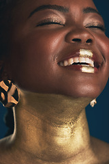 Image showing Smile, gold and makeup with face of black woman in studio for creative, luxury and cosmetics. Glow, glamour art and beauty with model on dark background for elegant, skincare and salon treatment