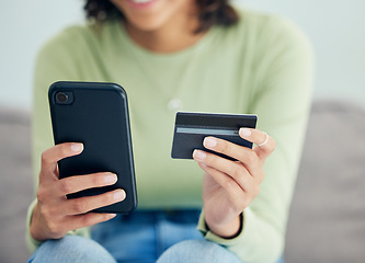 Image showing Phone, credit card and woman on a sofa for cashback, savings or ecommerce sale at home. Smartphone, and female customer in a living room for sign up, survey or bank, payment or budget, loan or invest