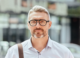 Image showing Mature business man, city and portrait with glasses, bag and ready for walk, travel and outdoor in metro. Entrepreneur, CEO or manager in road, traffic or sidewalk with pride on serious face in Milan