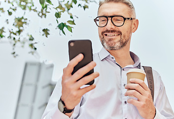 Image showing City, smile and a businessman with a phone and coffee for morning travel, communication or a chat. Happy, executive and a mature employee reading a conversation on a mobile from an app with a drink