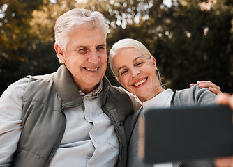 Image showing Senior couple, outdoor hiking and selfie with smile, web blog and memory in nature, sunshine and adventure. Elderly man, woman and together with social media, photography and profile picture in woods