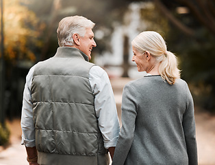 Image showing Relax, love and holding hands with old couple in nature for bonding, happy or peace. Smile, happiness and retirement with senior man and woman walking in countryside park for vacation and commitment