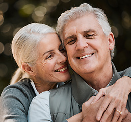 Image showing Love, travel and senior couple hug in a forest, happy and bond in nature on a weekend trip together. Smile, face and romantic old woman embrace elderly male in a forest, cheerful and enjoy retirement