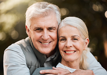 Image showing Smile, portrait and senior couple hug at a park with love, free and enjoy travel, holiday or weekend. Face, happy and elderly man embrace woman in forest, bond and fun on retirement trip together