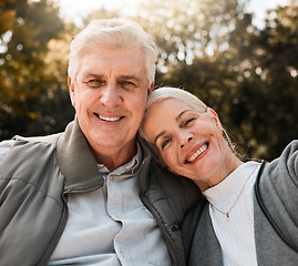 Image showing Love, portrait and senior couple hug in a forest, happy and bond in nature on a weekend trip together. Smile, face and romantic old woman embrace elderly male in woods, cheerful and enjoy retirement