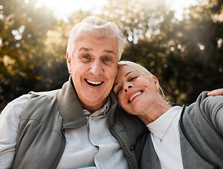 Image showing Happy, portrait and senior couple hug in a forest, love and bond in nature on a weekend trip together. Smile, face and romantic old woman embrace elderly male in woods, cheerful and enjoy retirement