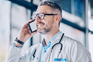 Image showing Thinking, smile and a doctor or man on a phone call for communication, healthcare advice or contact. Happy, idea and a mature medical employee speaking on a mobile for help with medicine work