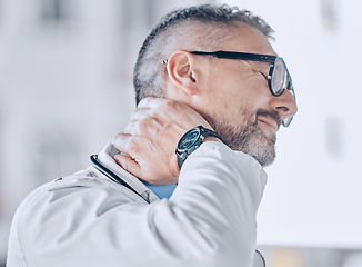 Image showing Medical, neck pain or optometry and a doctor in his office with an injury while feeling stress. Healthcare, burnout or accident with a mature optician holding his spine or shoulder in a clinic