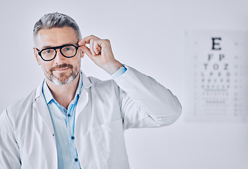 Image showing Portrait, glasses and eye exam with an optometrist man in his office for healthcare or vision improvement. Medical, frame and eyewear with a doctor or optician in a clinic for assessment and testing