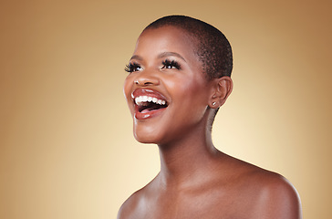 Image showing Beauty, laughing and a black woman with makeup in studio for skin care, glow and cosmetics. Face of a happy african person or model with facial shine, dermatology and wellness on a beige background
