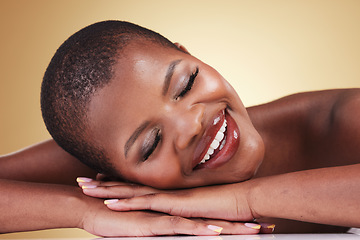 Image showing Makeup, face and beauty of happy woman in studio for self care, skin glow or cosmetics. Closeup of African aesthetic model person with facial shine, dermatology or relax on hands on beige background