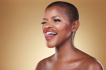Image showing Makeup, tongue out and black woman wink in studio for cosmetic wellness on brown background space. Beauty, face and African model with crazy emoji expression and glowing skin, results or satisfaction
