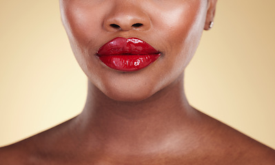 Image showing Red, lipstick and woman, beauty and makeup with closeup, skin and shine isolated on studio background. Bold cosmetic product, lips and cosmetology with elegance and glamour with color and glow