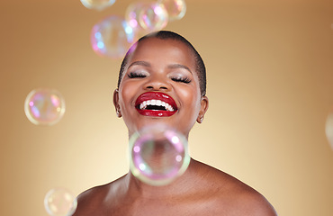 Image showing Cosmetics, makeup and bubbles with face of black woman in studio for beauty, spa treatment and luxury. Skincare, dermatology and self care with model on gold background for glow, facial and soap