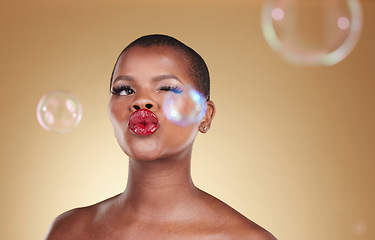 Image showing , makeup and bubbles with face of black woman in studio for cosmetics, spa treatment and luxury. Skincare, dermatology and self care with model on gold background for glow, facial and soap mockup