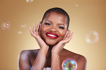 Image showing Happy, makeup and bubbles with portrait of black woman in studio for cosmetics, spa treatment and luxury. Skincare, dermatology and self care with model on gold background for glow, facial and beauty